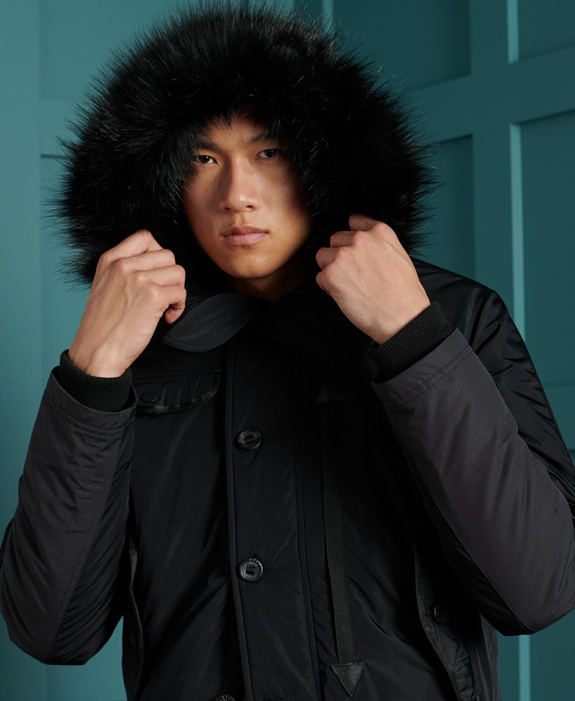 Keep warm and look great doing so, with the Chinook Rescue bomber jacket. Featuring an attached hood with a removable faux fur trim, a main zip and button fastening and a four pocket design.Recycled polyester paddingMain zip and button fasteningFour pocket designRemovable faux fur trimFleece lined hoodElasticated cuffs and hemSignature logo badgeThe padding in this jacket is 100% Recycled Polyester – each jacket contains up to 10 recycled bottles, this avoids these bottles being sent to landfill or polluting our oceans. 