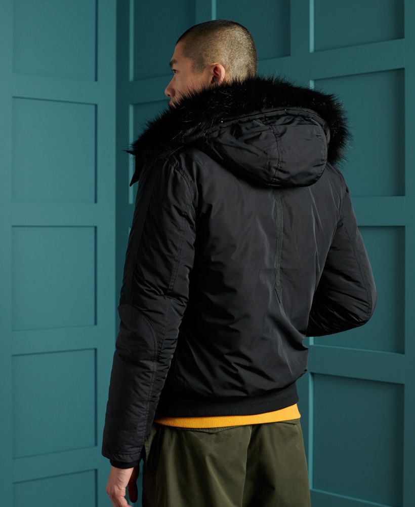 Keep warm and look great doing so, with the Chinook Rescue bomber jacket. Featuring an attached hood with a removable faux fur trim, a main zip and button fastening and a four pocket design.Recycled polyester paddingMain zip and button fasteningFour pocket designRemovable faux fur trimFleece lined hoodElasticated cuffs and hemSignature logo badgeThe padding in this jacket is 100% Recycled Polyester – each jacket contains up to 10 recycled bottles, this avoids these bottles being sent to landfill or polluting our oceans. 