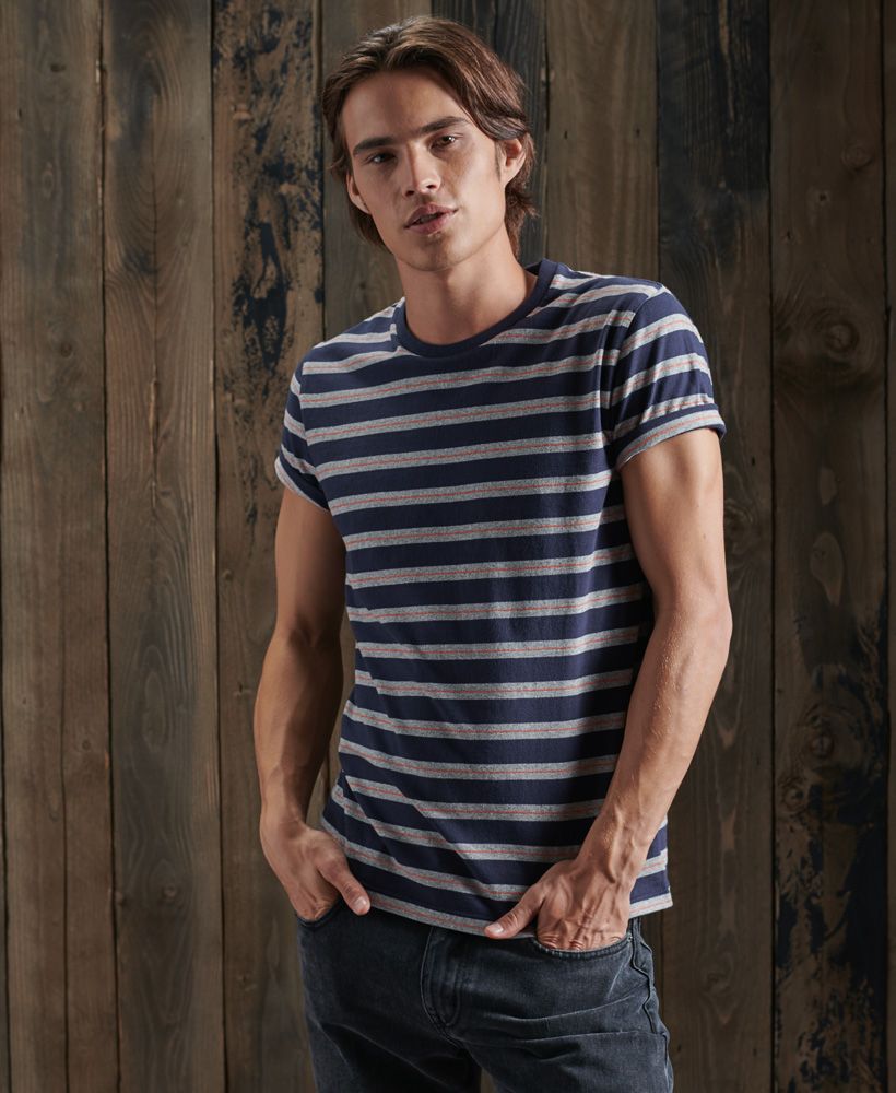 Update your tee collection with the Off Piste stripe tee. This 100% Organic cotton tee features an all over striped design and will look great paired with your favourite pair of jeans.Slim fit – designed to fit closer to the body for a more tailored look100% Organic cottonCrew neckShort sleevesAll over striped designSignature logo patchMade with Organic Cotton - Grown using only organic inputs and no artificial chemicals, which leads to improved soil condition, stronger biodiversity and better health among the cotton growers and uses between 60-90% less water to grow. By 2030, all Superdry Cotton will be Organic.