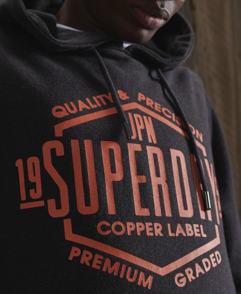 Update your hoodie collection with the Copper Label hoodie, featuring a loopback lining making it the perfect layering piece to keep you warm this season. Complete the look with your favourite jeans and trainers.Slim fit – designed to fit closer to the body for a more tailored lookDrawstring hoodFront pouch pocketRibbed cuffs and hemPrinted Superdry graphicSignature logo patch