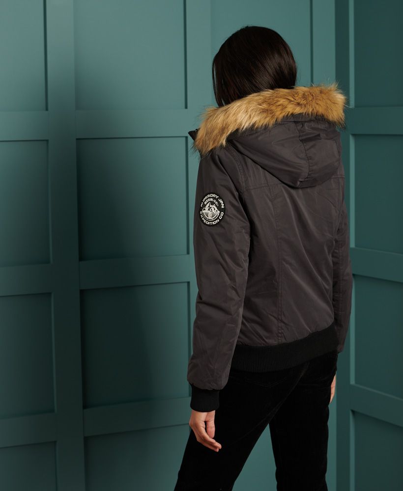 Perfect for those cold winter months, the Microfibre Bomber Jacket featuring a removable faux fur trim on the hood. Layer over a classic hoodie with jeans to complete the look and provide extra warmth and comfort this season.Main zip fasteningFour external popper fastened pocketsTwo faux zip pocketsHood with detachable faux fur trimRibbed cuffs and hemSignature logo badge