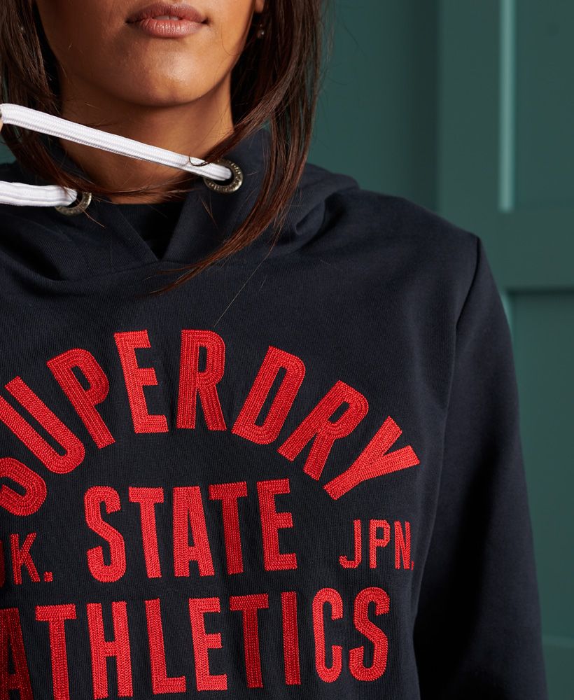 You can't go wrong with a varsity inspired hoodie, introducing the Varsity 11 Standard Hoodie featuring loopback lining, front pouch pocket, drawstring hood and ribbed detailing.Drawstring hoodFront pouch pocketLoopback liningRibbed hem and cuffEmbroidered graphicSignature logo tab