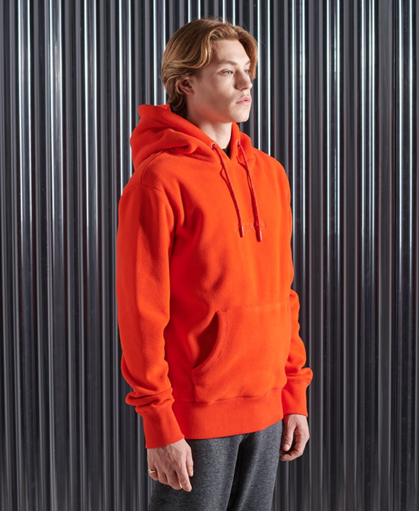 Perfect for the cold this season, the Polar fleece hoodie is designed with your warmth and comfort in mind; made from a complete fleece fabric.Relaxed fit – the classic Superdry fit. Not too slim, not too loose, just right. Go for your normal sizeDrawstring hoodFront pouch pocketPolar fleece fabricRibbed cuffs and hemEmbroidered logo