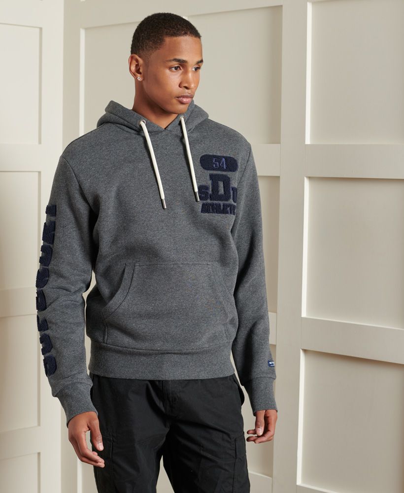 Stay warm and look stylish this season with the Track & Field embroidered hoodie. A classic overhead hoodie featuring a soft brushed lining, a large pouch pocket and finished with embroidered detailing on the sleeves.Slim fit – designed to fit closer to the body for a more tailored lookDrawstring adjustable hoodRibbed cuffs and hemBrushed liningEmbroidered detailingSignature logo patch