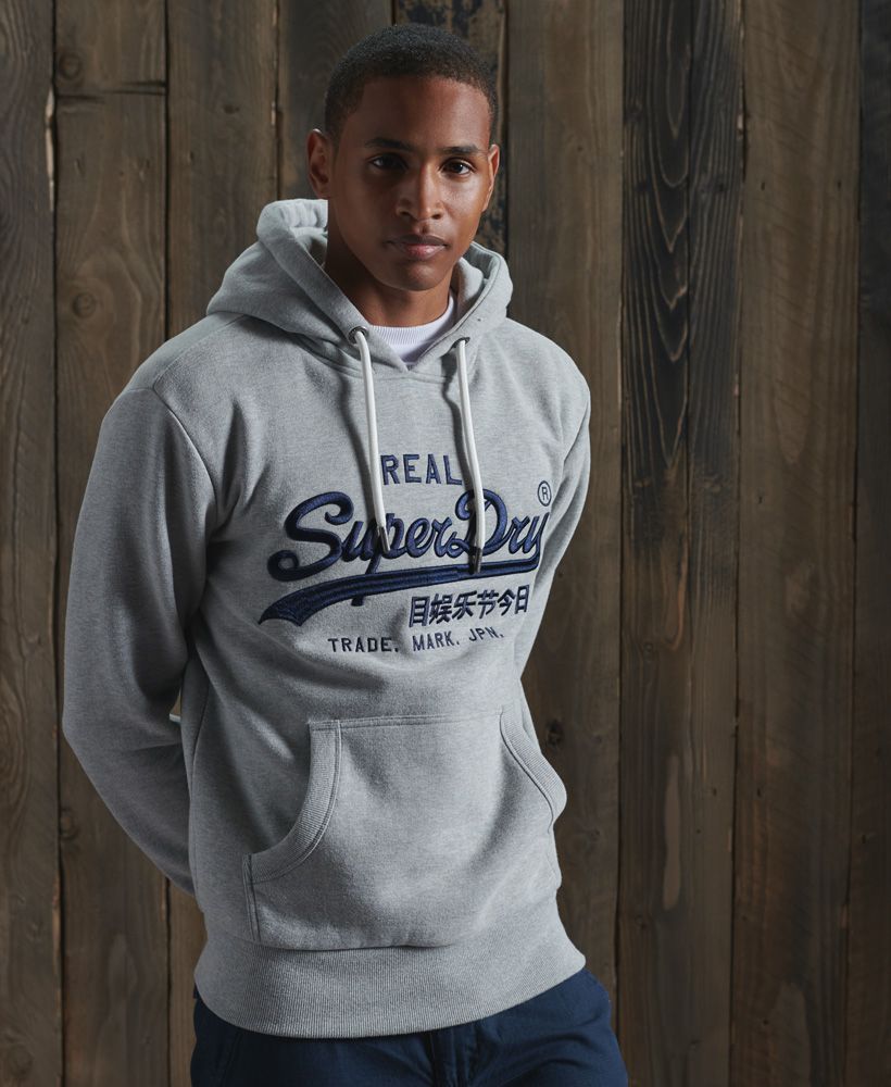 You can't go too far wrong with our iconic Vintage Logo, and this time it's in premium embroidered form, prominently across the chest of this classic design hoodie.Slim fit – designed to fit closer to the body for a more tailored lookDrawcord hoodFront pouch pocketRibbed cuffs and hemSignature embroidered logoBranded metal hardwareBrushed lining