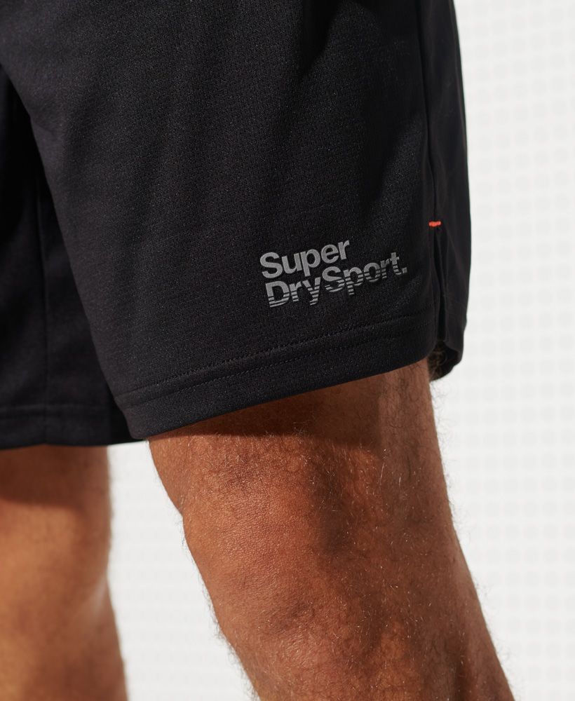 Superdry men's Training shorts. These stretchy and lightweight shorts are made from Superdry fabric, designed to keep you dry and cool for longer. Featuring a drawstring waist, two zip fastened pockets, and split side seams. Finished with a reflective Superdry logo above the hem.Relaxed: A classic fit. Not too slim, not too tight – no distractions here