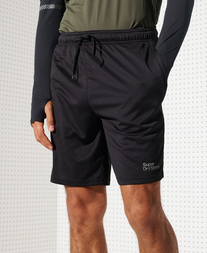 Superdry men's Training shorts. These stretchy and lightweight shorts are made from Superdry fabric, designed to keep you dry and cool for longer. Featuring a drawstring waist, two zip fastened pockets, and split side seams. Finished with a reflective Superdry logo above the hem.Relaxed: A classic fit. Not too slim, not too tight – no distractions here