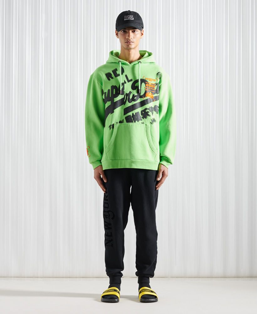 Express yourself and go bold with this statement hoodie that's bound to make a unique impression.Oversized fit – exaggerated and super relaxed, let your style flowFleece liningDrawstring hoodFront pouch pocketRibbed cuffs and hemPrinted logoTextured graphics