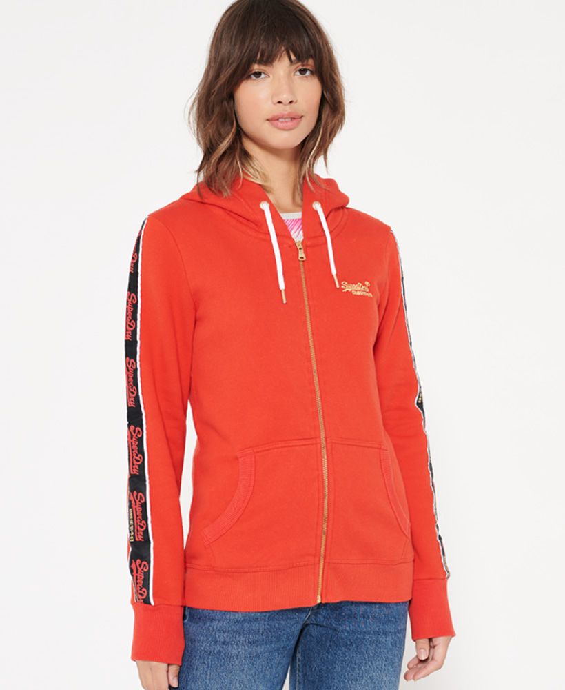 Superdry women's CNY zip hoodie. This hoodie has been inspired by the celebration of the Chinese New Year. This hoodie features a main zip fastening, a drawstring hood, two pouch pockets and ribbed cuffs and hem. Completed with striped Superdry logo detailing down the sleeves and an embroidered Superdry logo on the chest.