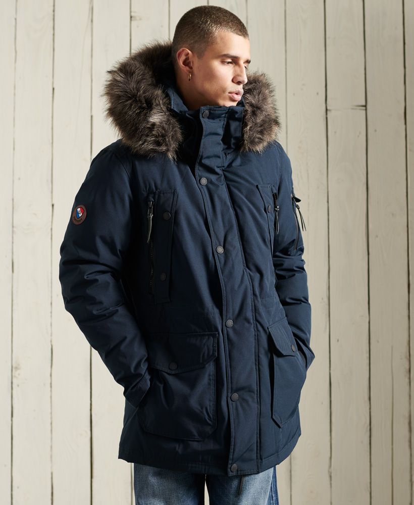 Just what you need to keep you warm and looking on trend this season. This Premium Down Parka Coat features a super warm down padding, a zip and popper fastening and a removable faux fur trim on the hood.Nine pocket designAdjustable Hood with removable faux fur trimZip and popper fasteningMulti-way zipsSignature logo badgeBungee cord adjustable waistSingle inner pocket90/10 Down fillingSuperdry is certified by the Responsible Down Standard (RDS) - all our down is sourced to ensure animal welfare.
