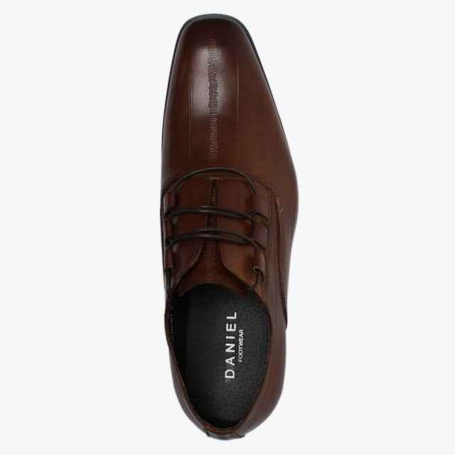 The Daniel Xenoblast Leather Loop Lace Up Shoes are part of the New Season collection. This smart style is crafted from a premium leather upper with part leather lining and rubber sole. The loop lace up upper provides an easy wear and ensures the perfect fit. Top stitching and raised seaming add detail to the upper as well as a textured design. Signature Daniel branding is seen on the foot-bed.