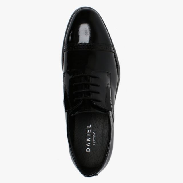 The Daniel Xlol Patent Leather Lace Up Brogues are a classic style and wardrobe staple. This New Season version is the perfect addition to your wardrobe. The ‘Xlol’ men's dress shoes are crafted from a premium patent leather upper with leather lining and a comfy rubber sole. The lace up upper provides an easy wear and ensures the perfect fit. Heritage brogue designer adds detail to the upper as well as top stitching and raised seaming. Signature Daniel branding is seen on the foot-bed.