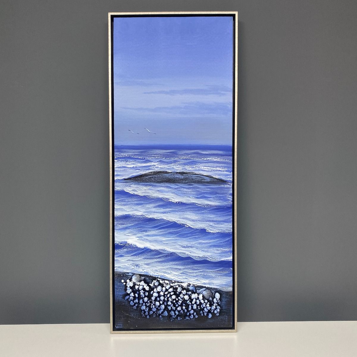 Bold and beautiful floral canvas print frame with brushed silver.

Hand Painted Canvas Print
Height: 100cm
Width: 40cm
Depth: 5.5cm
Frame Colour: Brushed Silver
Hanging Position: Portrait

Perfect for updating your home, this elegant, sky blue seaside canvas is hand-painted and finished beautifully with a brushed silver frame. Add a pop of colour into any interior with this stunning piece. Perfect for living rooms and bedrooms seeking colour and class! Amazing on it's own or ideal as a set with the rest of the Beach Shells range