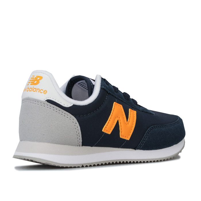 Children Boys New Balance 720 Trainers in navy - Yellow. – Nylon upper with synthetic suede overlays. – Lace up fastening. – Padded collar. – Contrast heel patch. – Comfortable textile lining. – Removable cushioned sockliner. – EVA foam midsole for lightweight cushioning. – New Balance branding at tongue side and heel. – Durable rubber outsole. – Textile upper – Textile lining – Synthetic sole. – Ref: YC720NBY