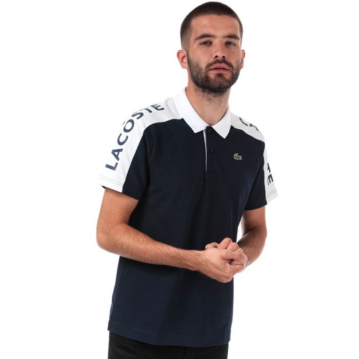 Mens Lacoste Sport Breathable Resistant Pique Polo  Navy - White.<BR><BR>- Run-resistant and ultra-dry breathable piqué.<BR>- Two-button ribbed polo collar.<BR>- Contrast short sleeves<BR>- Lacoste branding on right shoulder<BR>- Green crocodile transfer on chest<BR>- 100% Polyester  Machine washable.<BR>- Ref: YH300100R20