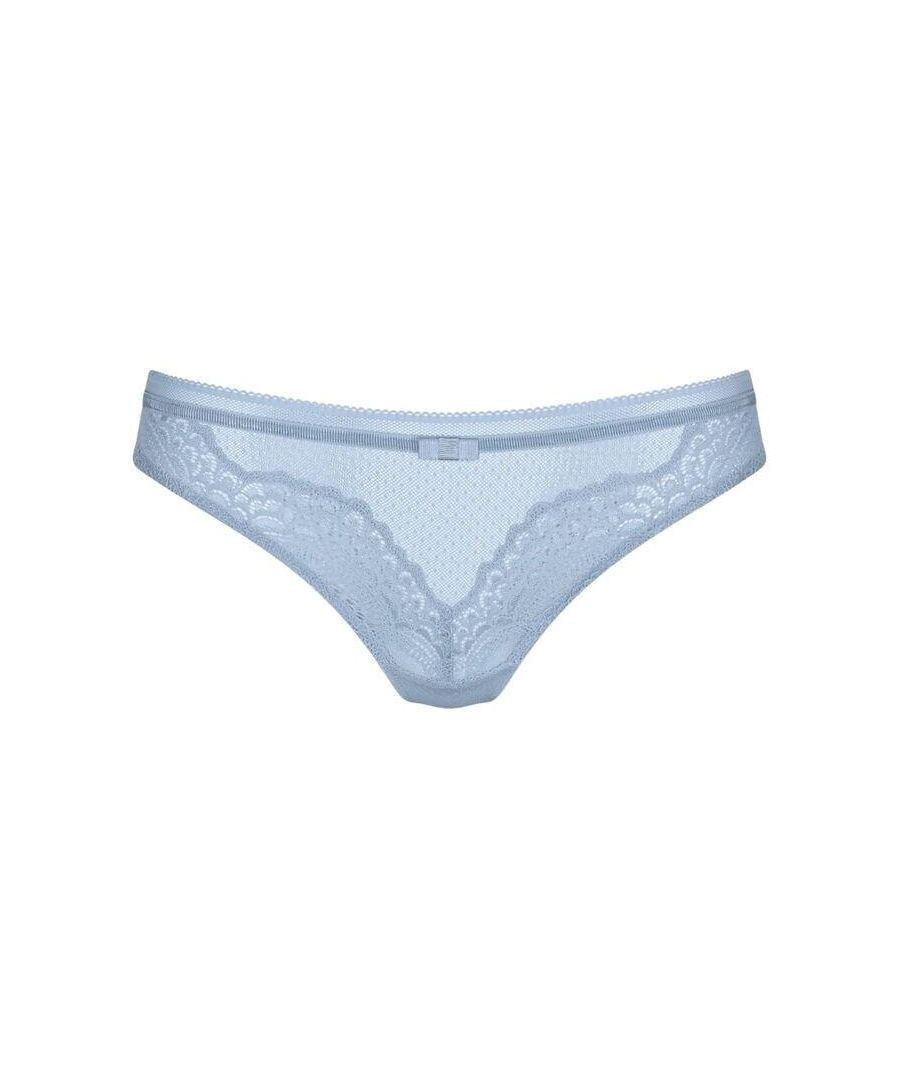 Stunning and feminine, this thong from Triumph is your next everyday lingerie staple. Paired perfectly with a Triumph bra, this thong is all you need to complete the set. This thong is designed with comfort in mind, featuring a classic, flattering fit with elastic and a hip cut. The semi-sheer fabric with dot detail is beautiful yet subtle. Finished with lace trim and a pretty bow, this thong is a great everyday choice!\n\nEveryday flattering thong from Triumph\nSemi-sheer tulle with lace trim\nComposition - 79% Polyamide | 21% Elastane\n\nListed in UK sizes
