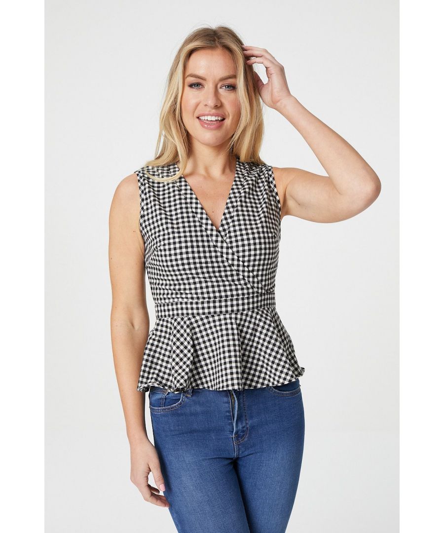Add a bold gingham checked blouse to your new season style. With a faux wrap front, a v-neck, a sleeveless fit, a figure flattering peplum shape and a hidden side zip. Pair with a tailored skirt and heels for the office or with jeans and heels for date night.