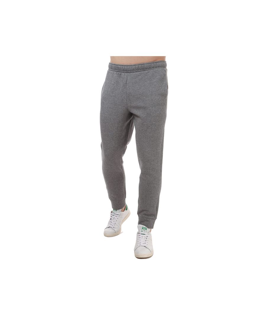 Mens Calvin Klein Knit Jogging Bottoms in grey.<BR><BR>- Drawcord on elastic waist.<BR>- Side pockets<BR>- Calvin Klein  logo at left thigh.<BR>- Rib-knit cuffs<BR>- Regular fit.<BR>- 100% Cotton. Machine wash at 30 degrees.<BR>- Ref: 00GMF0P769077