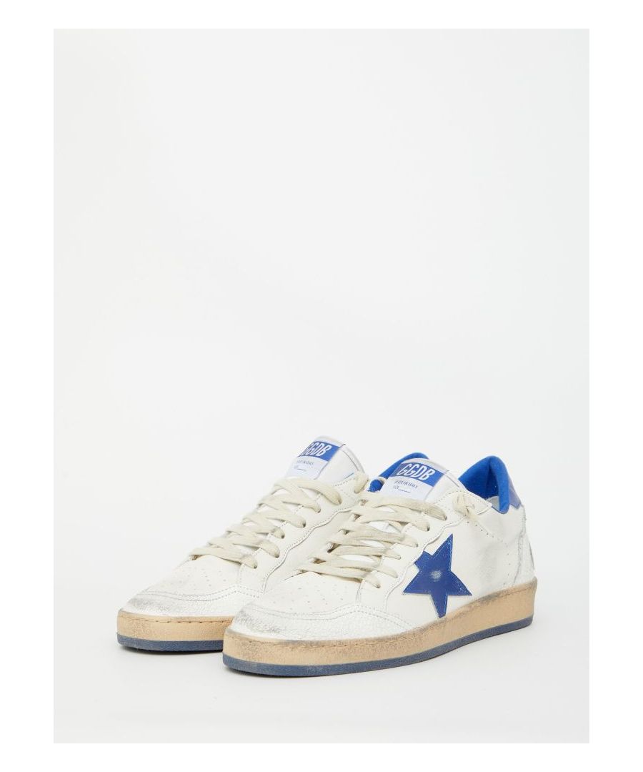 Vintage-effect Ball Star sneakers in white leather with blue leather side star and heel. They feature round toe, lace-up closure, GGDB/BALLSTAR logo on the side and Sneakers logo embossed on heel. Rubber sole.
