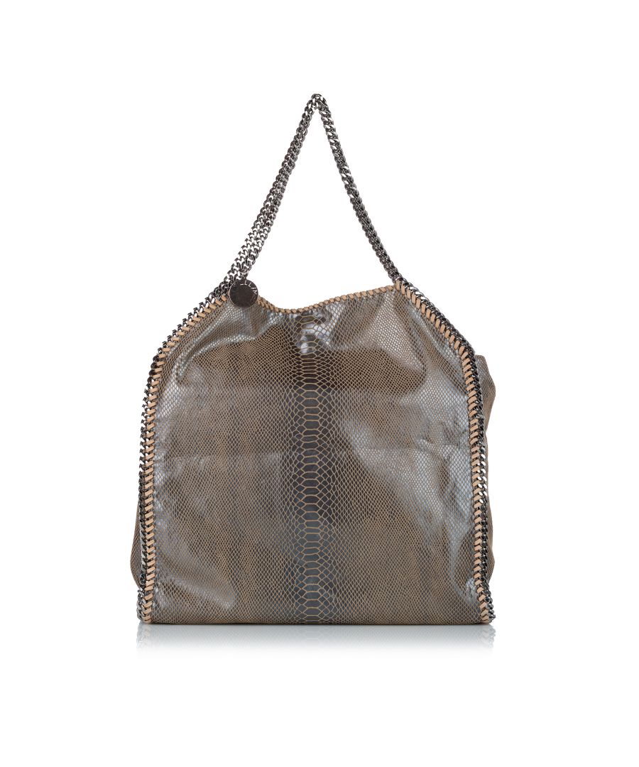 VINTAGE. RRP AS NEW. The Falabella tote bag features a python embossed fabric body, silver-tone chain straps, a top magnetic snap button closure, and an interior zip pocket.Exterior front, back and sides are scratched and discolored.\n\nDimensions:\nLength 42cm\nWidth 42cm\nDepth 10cm\nHand Drop 22cm\nShoulder Drop 22cm\n\nOriginal Accessories: Pouch, Dust Bag\n\nSerial Number: none\nColor: Gold x Silver\nMaterial: Fabric x Others x Metal x Brass\nCountry of Origin: Italy\nBoutique Reference: SSU121154K1342\n\n\nProduct Rating: GoodCondition