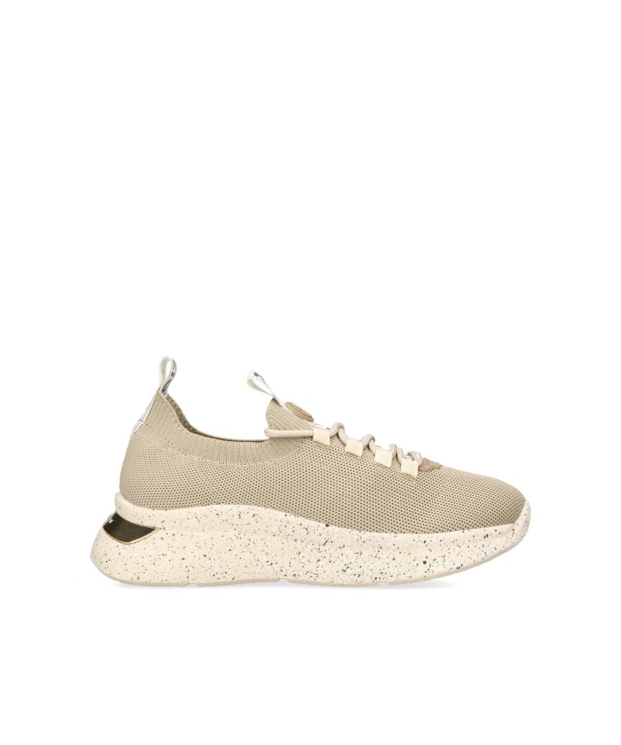 Kaker Speckle from KG Kurt Geiger is a low top, lace up trainer with a beige fabric upper and thick sole.