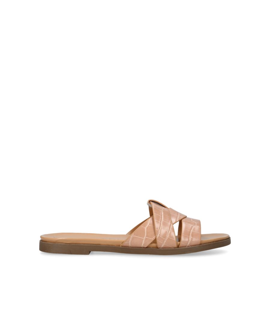 The Ruby is a slip-on sandal with a blush croc embossed upper. The footbed is padded for extra comfort. This product has undergone 167 checks to be registered with The Vegan Society. This product arrives in a recycled and recyclable box with handle, so a plastic bag is not needed.