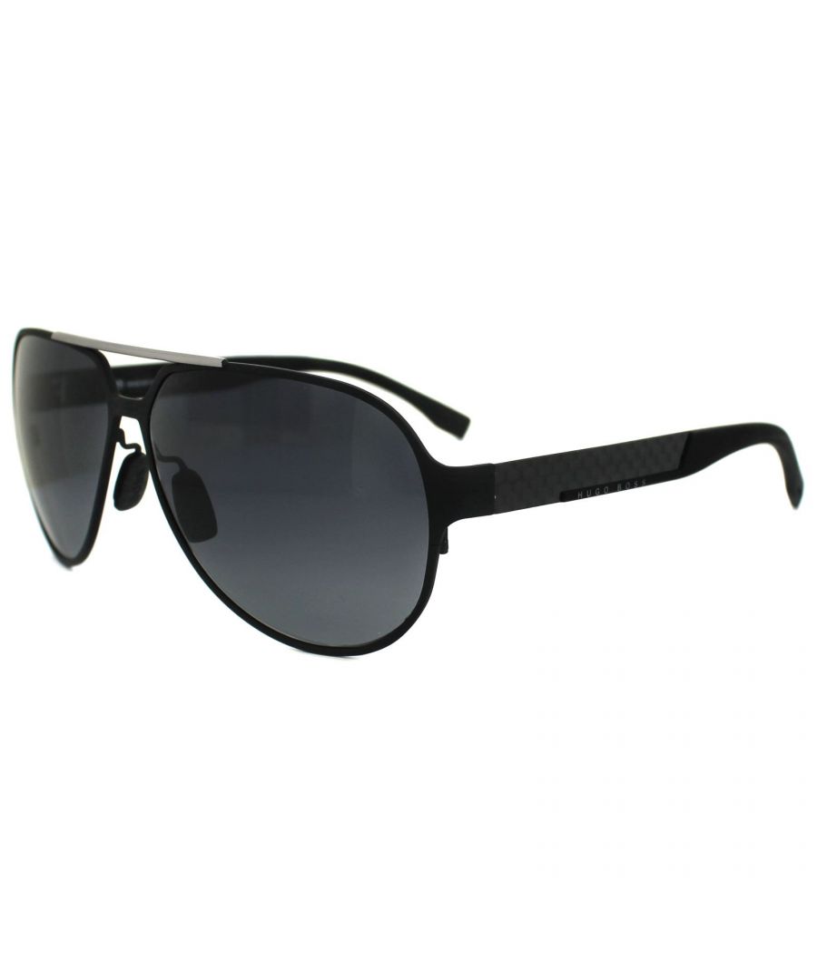Hugo Boss Sunglasses 0669 HXJ HD Matt Black Ruthenium Grey Gradient are made of Carbon fibre and mixed with rubber for a truly lightweight flexible frame. The rubber temple end pieces are adjustable for comfort and have a micro texture for added grip. The shape is a large pilot aviator which with the high quality of the materials used is very appropriate.