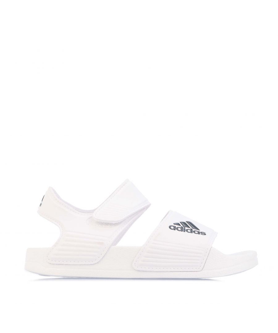 Childrens adidas Adilette Slide Sandals in white black.- Synthetic upper.- Hook-and-loop closure.- Regular fit.- Contoured footbed.- EVA midsole and outsole.- Quick drying.- Textile lining.- EVA midsole and outsole.- Ref.: GW0342C