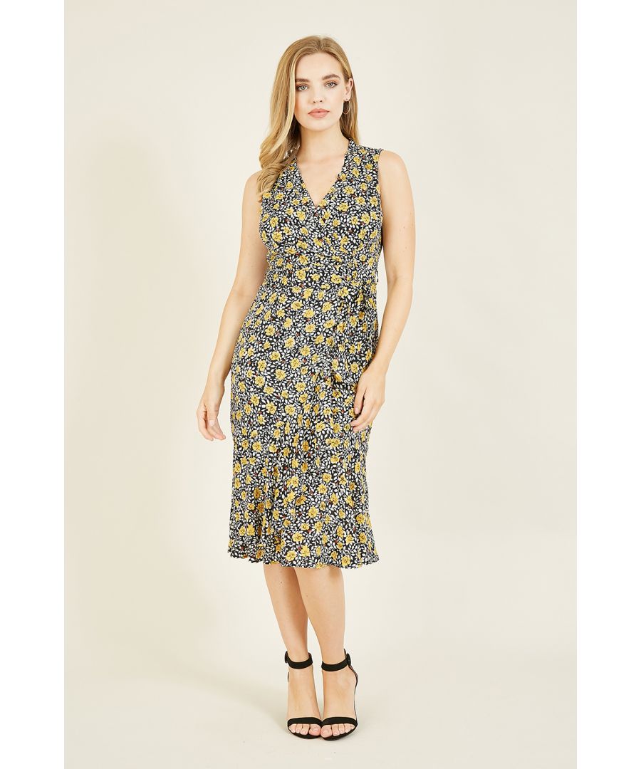 Featuring a stunning floral print, aflattering wrap around cut and waist tie belt, this sleeveless Black Floral Wrap Over Midi Dress works equally in warm weather or with added layers. Match with ankle boots and leather or denim.
