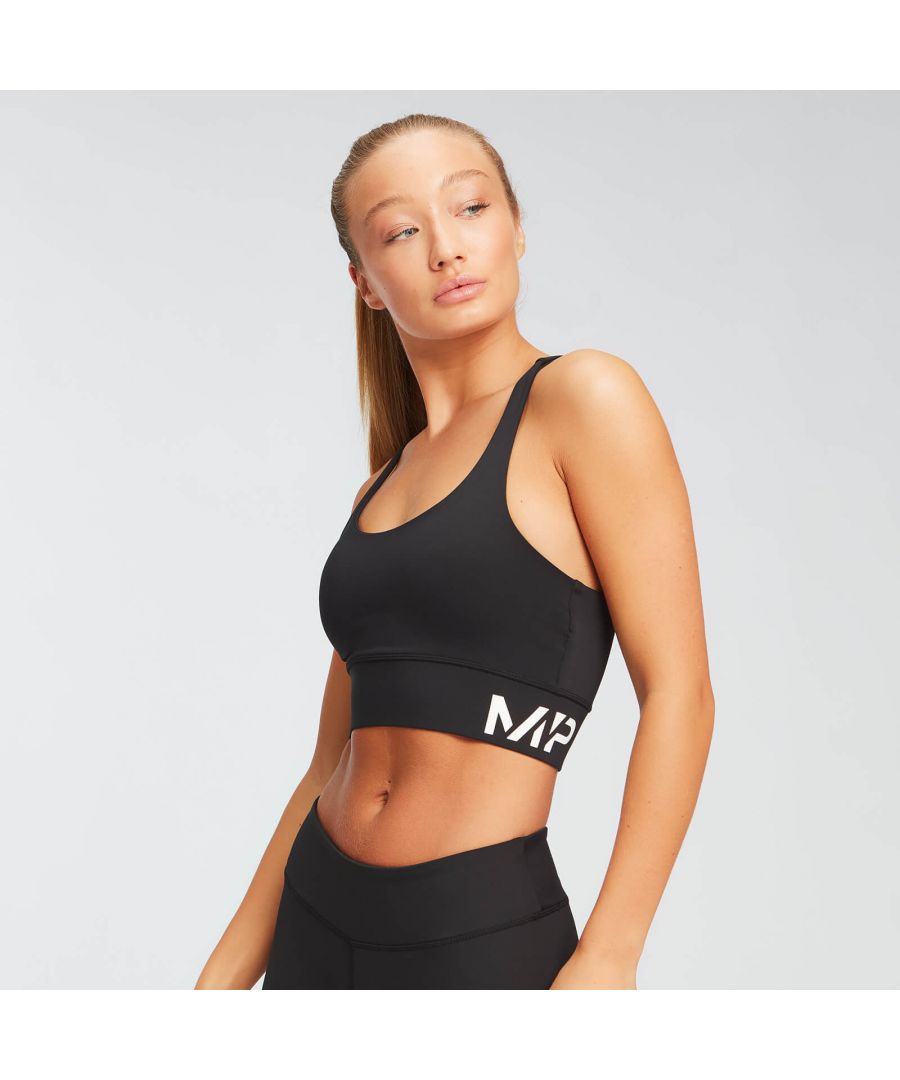 Our Essentials Training Sports Bra is designed for easy, everyday wear with light support thanks to removable padded cups.\nThe minimalist racerback detail is built for freedom of movement, while the branded elastic under-bust band keeps you comfy all day.\nThe garment fibres are treated with a hydrophilic finish to wick away moisture from the body, keeping you cool and comfortable whatever activity you take on.\nFabric: 81% polyester 19% elastane ​