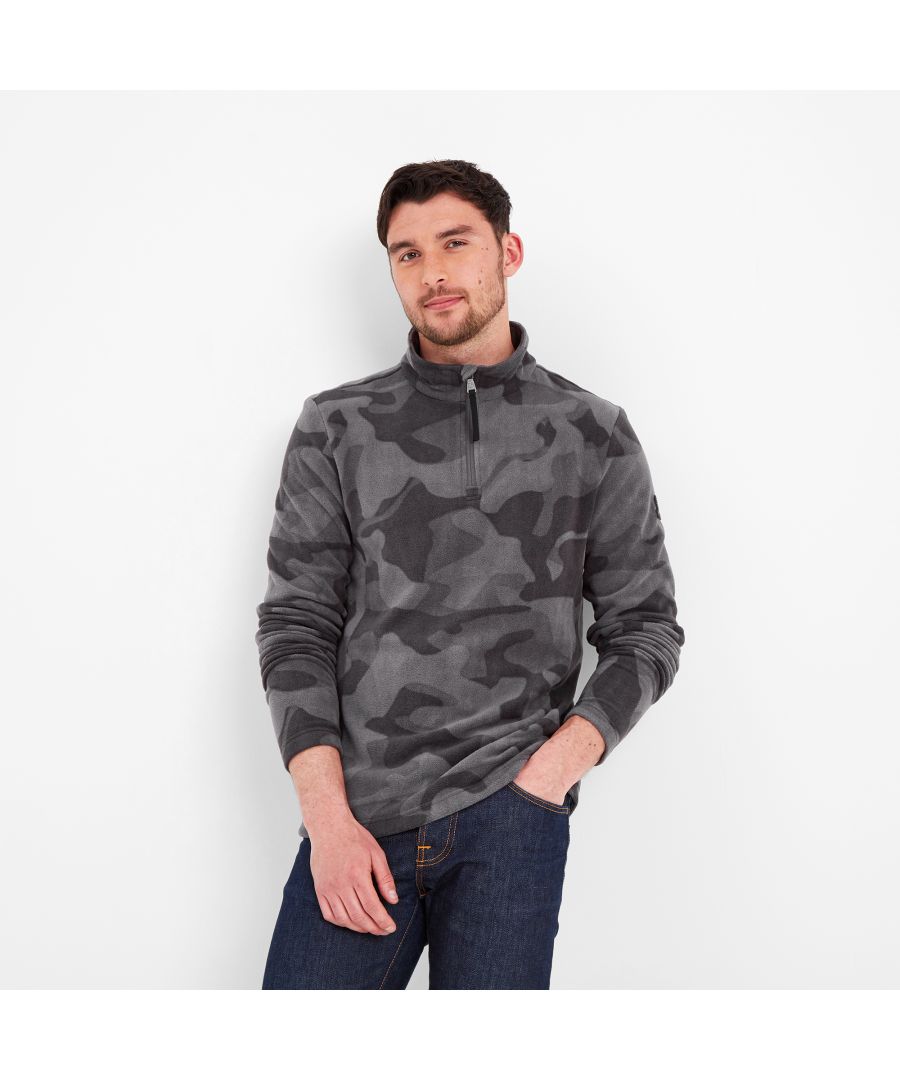 Designed in a distinctive camo print in colours inspired by the rugged Yorkshire landscape, our Bleakholt fleece is supersoft and lightweight and makes an ideal mid-layer. You can wear it under an outdoor coat for a brisk walk across the moors, or over fitness clothes at the gym. Bleakholt has a neck zip, so you can open it up when you build up a sweat or keep it zipped tight when the wind is whistling, as it often is in West Yorkshire where this warm and cosy microfleece was designed. It has been specially treated to help prevent pilling and bobbling, so it stays looking good for longer, wash after wash. The finishing touch is our signature TOG24 rose rubber badge on the sleeve.