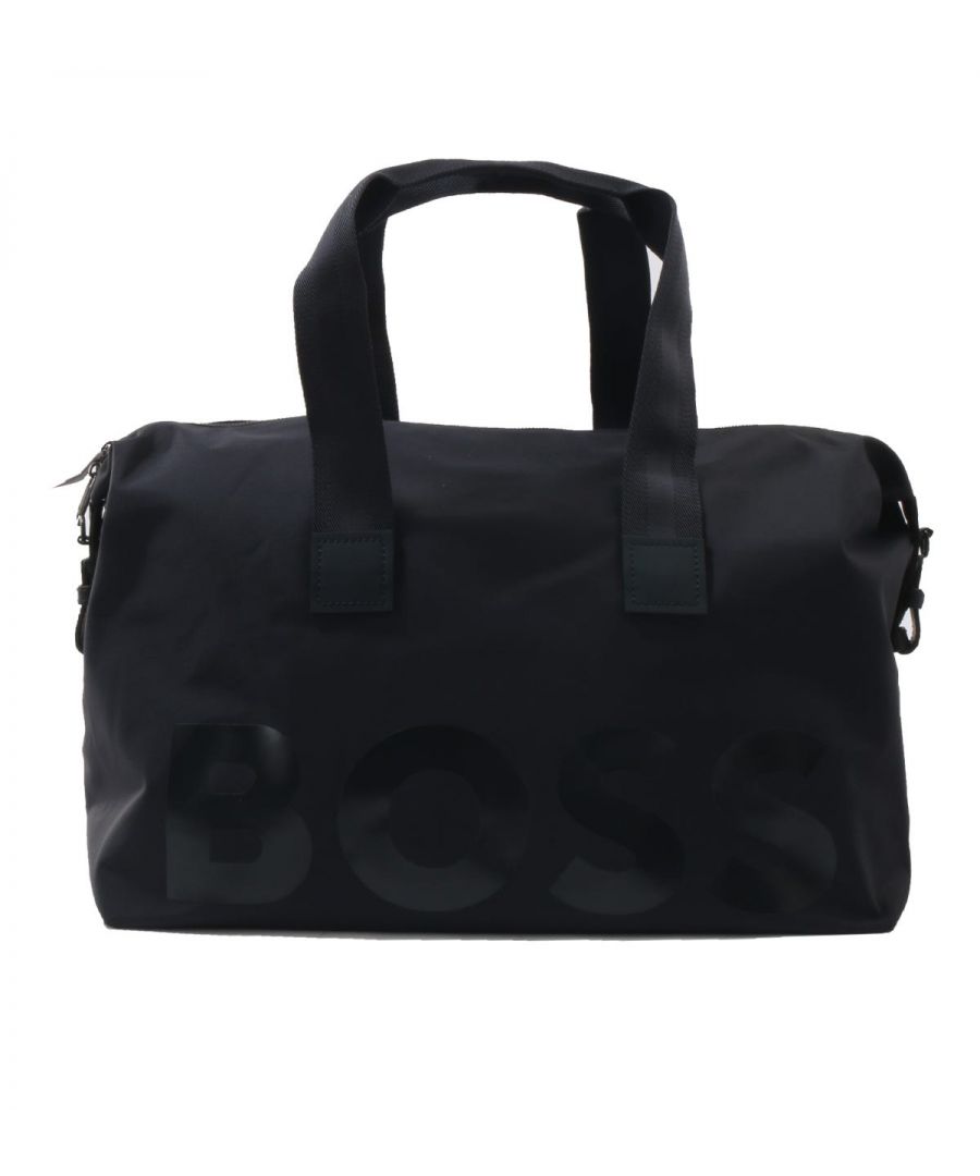 A stylish companion for your travels, the Gloss Logo Holdall Bag from BOSS has all the room for your traveling essentials. Crafted from recycled nylon providing sustainable durability without compromising on style. Featuring one main zip compartment with internal pockets for easy storage, twin carrying handles, a detachable shoulder strap and snap adjusters to the exterior. Finished with a high gloss BOSS logo to the front.Recycled Nylon, Main Zip Compartment, Interior Zip & Open Pockets, Webbing Carrying Handles, Detachable Adjustable Webbing Shoulder Strap, Dimensions: 48.5 x 30 x 25cm, BOSS Branding.