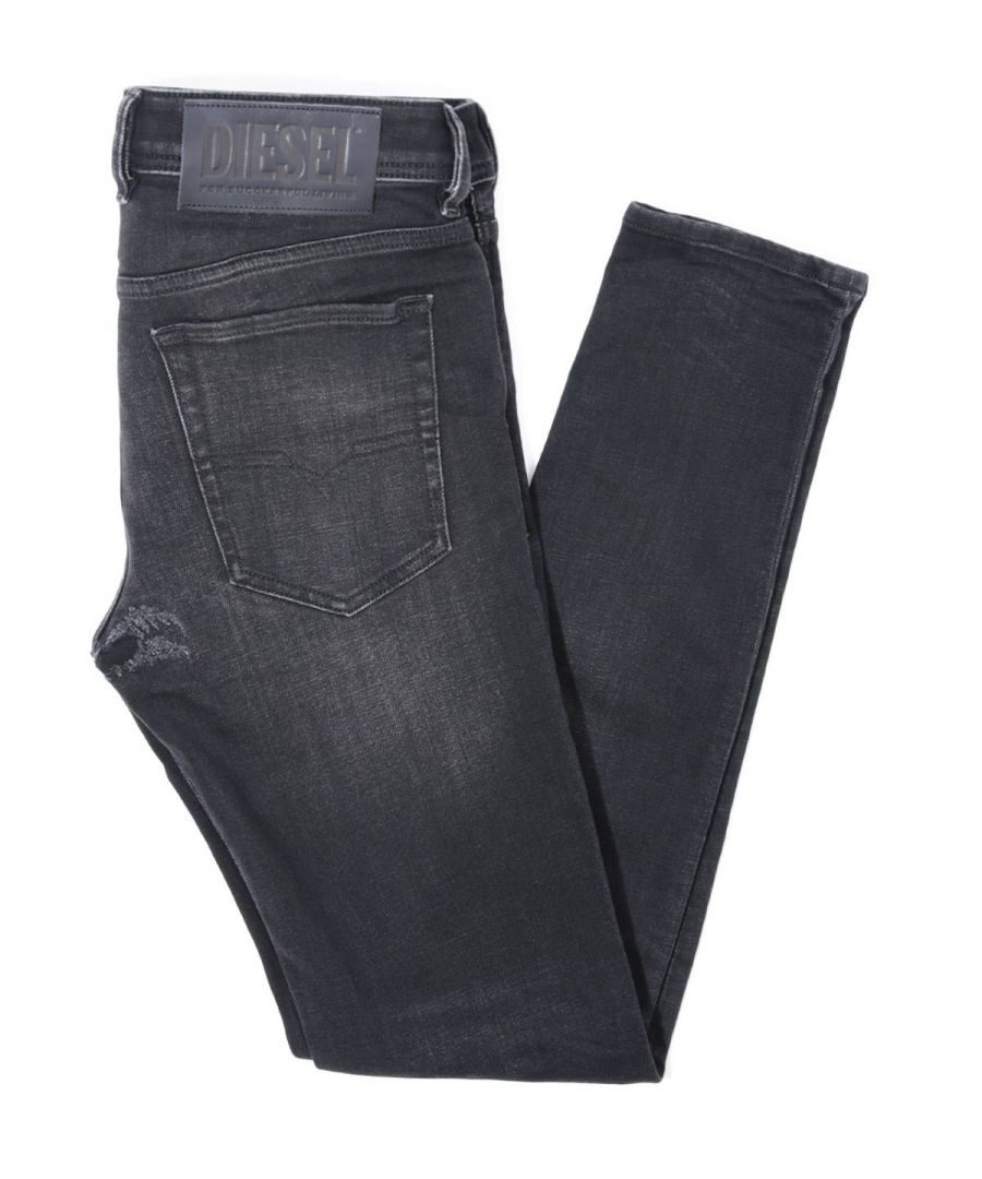 Designed with a punk-rock attitude in mind, the Sleenker Skinny Fit Jeans from Diesel are cut with a low waist and a regular length. Crafted from stretch BCI cotton denim, ensuring all-day comfort and ease of movement. Featuring a traditional five-pocket design with a button fly fastening, visible whiskering and handmade distressing. Finished with signature Diesel branding. BCI - By buying BCI cotton products, you're supporting more responsibly grown cotton through the Better Cotton Initiative. Skinny Fit , Stretch BCI Cotton Denim, Five Pocket Design, Button Fly Fastening, Belt Looped Waist, Visible Whiskering & Distressing, Diesel Branding. Style & Fit: Skinny Fit, Fits True to Size. Composition & Care: 95% Cotton, 3% Polyester, 2% Elastane, Machine Wash.