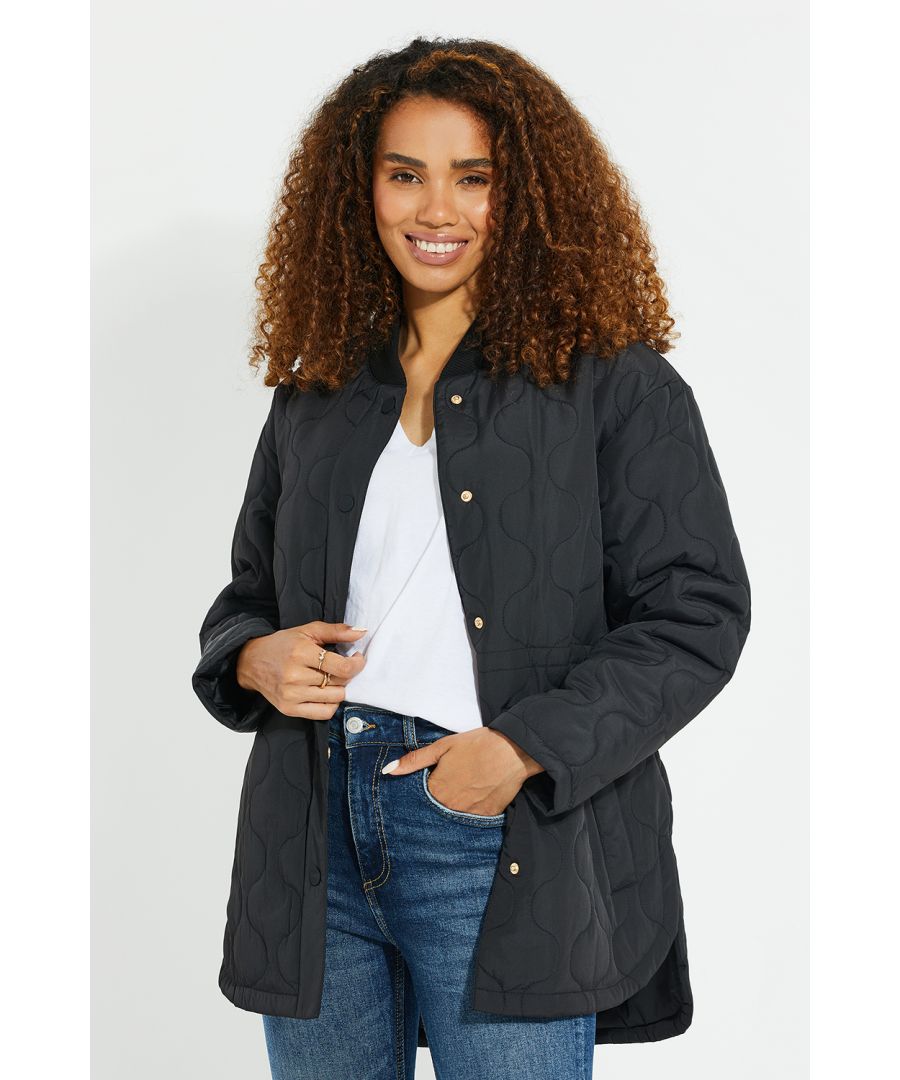 This quilted jacket from Threadbare features a collarless design, two open pockets, and snap fastenings. Wear loose or nipped in at the waist with the internal drawcord. Available in a range of colours.