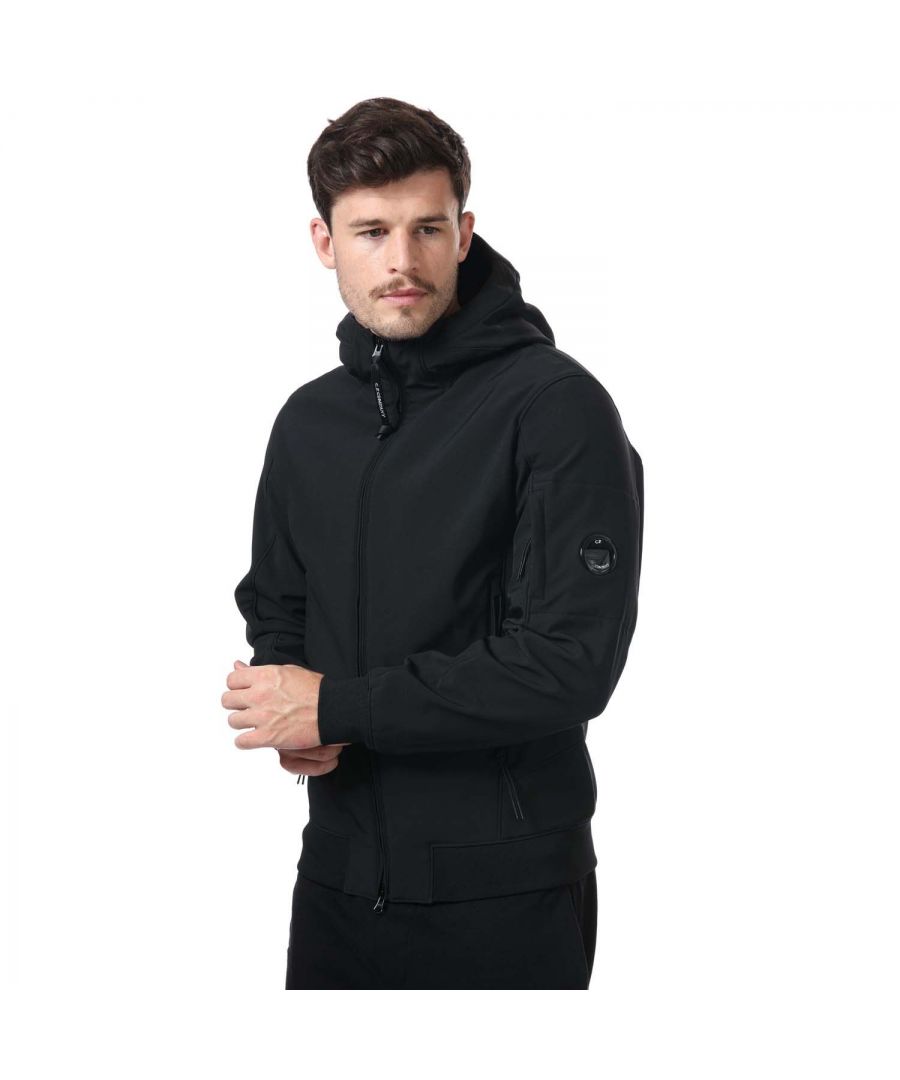 Mens C.P. Company Shell- R Jacket in black.- Adjustable hood.- 2 side zipped pockets.- Ribbed cuffs.- C.P. Company sleeve lens and arm pocket.- Regular fit.- 94% Polyester  6% Elastane.- Ref: 13CMOW003A999