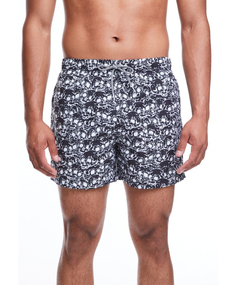 Trying to get some darker styles into our Boardies® collection is not easy! However these new Skulls shorts are killer. Hand-drawn by our tattoo friend Eka in Bali, they're inspired by 80's skate brands and metal graphics. They're made from 100% super-soft, quick drying polyester and come in a classic mid-length - you'll dead cool.