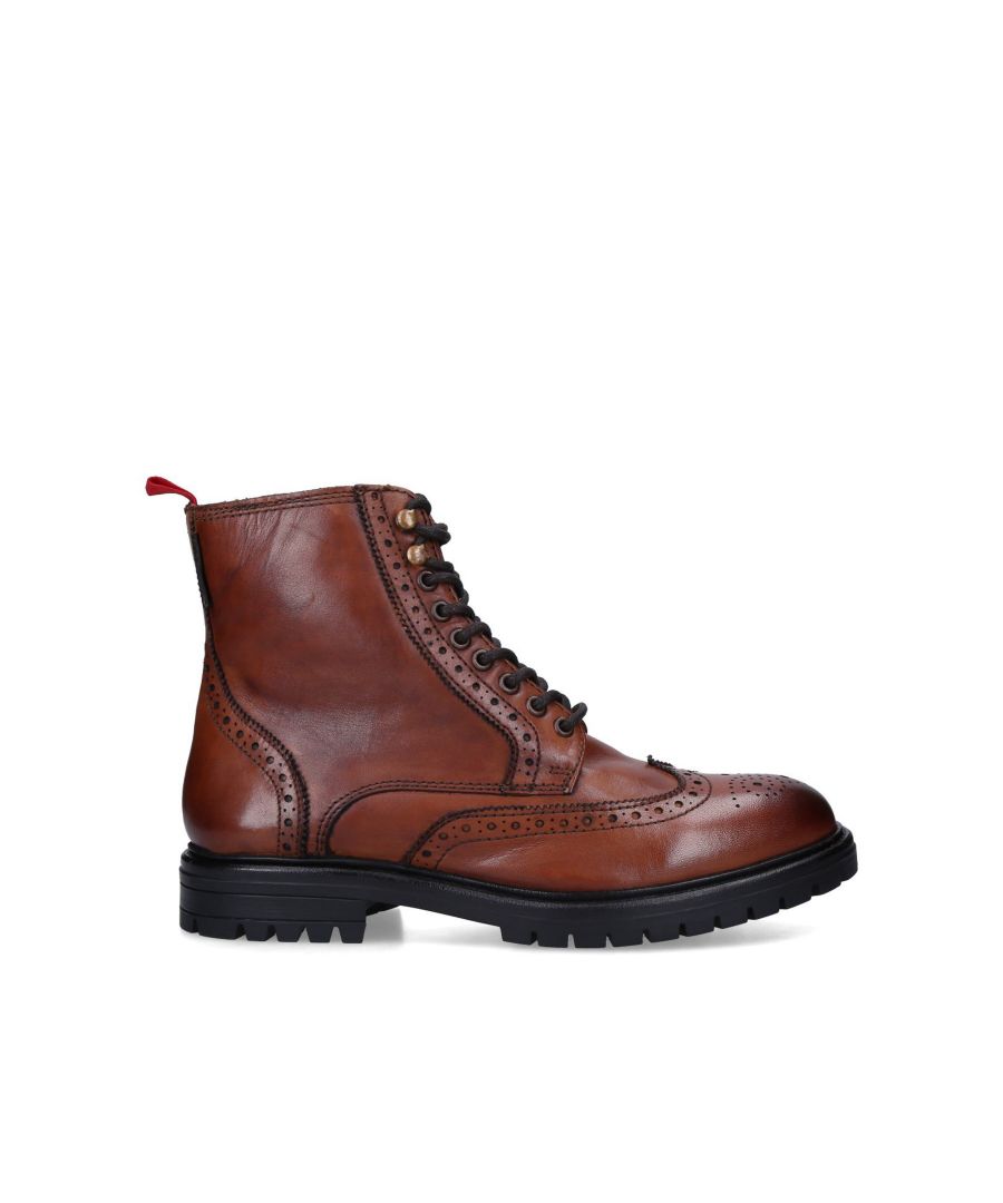 The wingtip and upper stitching across this PRYOR boot from KG Kurt Geiger makes for a unique addition to any boot collection. The lace up front uses brown and bronze loop eyelets and a red woven tab for a pop of colour. The black sole is simply designed with a slight tread.