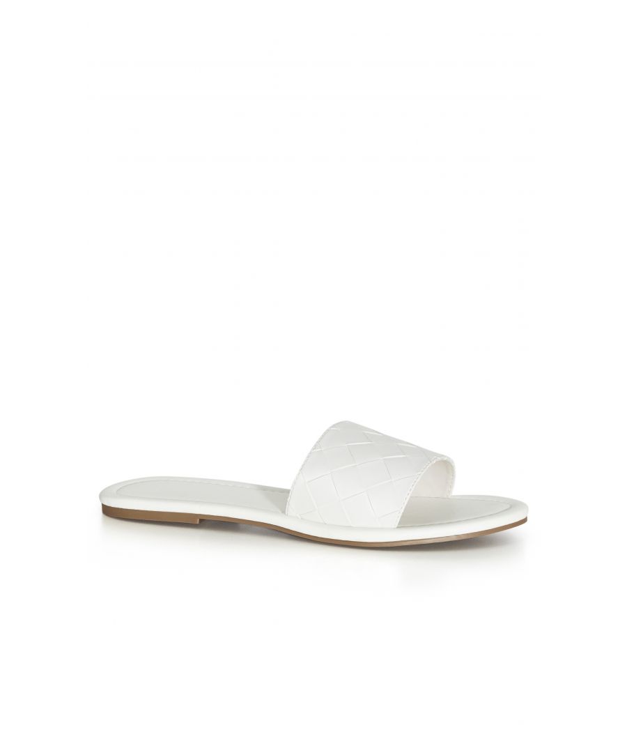 You can't go wrong with a pair of sleek slides! Our Weave Slide offers crisp white hue and woven detail, as well as an wide fit for added comfort. From laidback lunching to shopping dates and everything in between, these staple slides have you sorted. Key Features Include: - Round open toe - Slip on style - Faux leather upper - Woven detail Complete a flirty and feminine day look for rooftop drinks with the girls with your favourite floral mini dress and a round rattan bag.