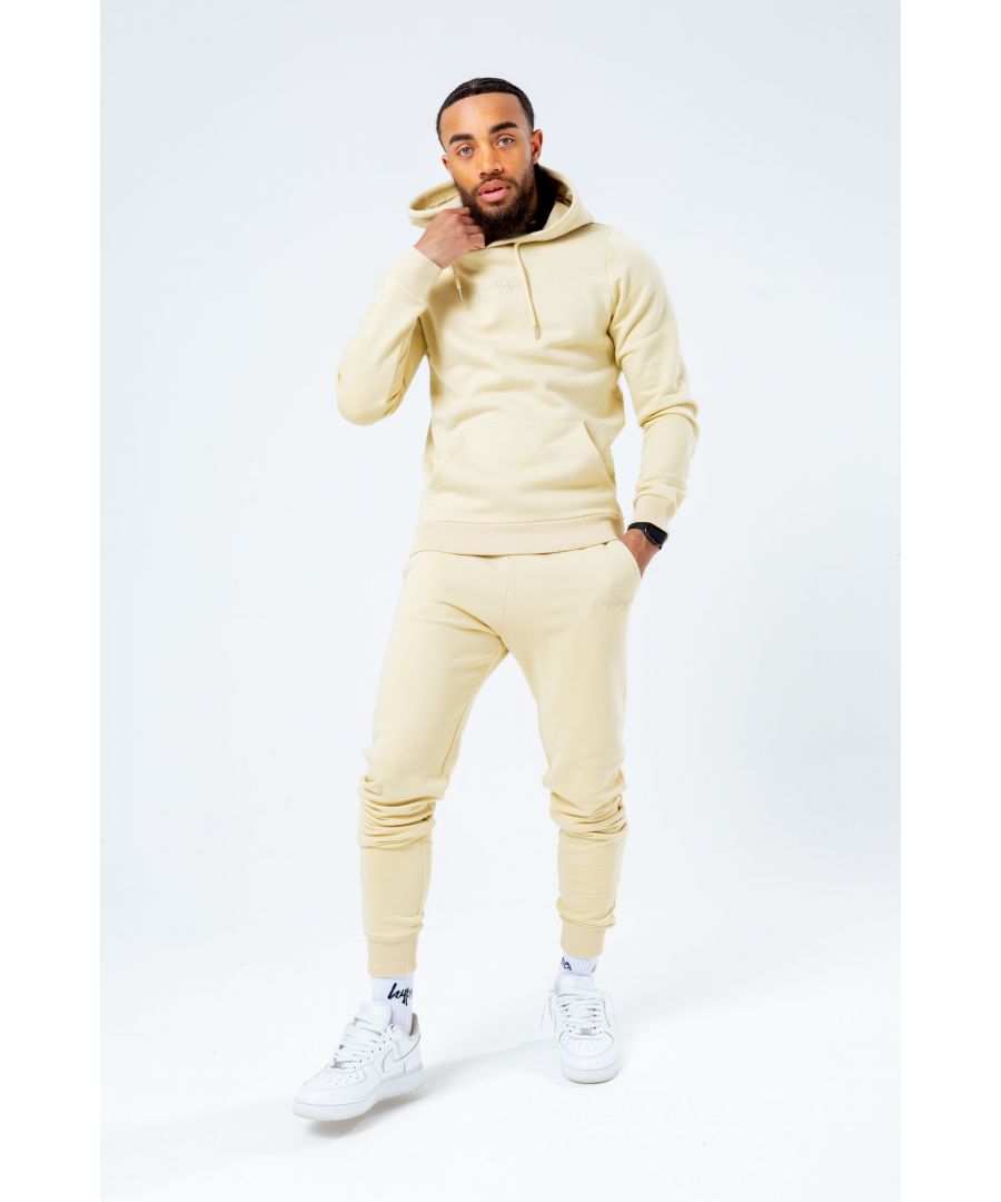 Introducing the freshest loungewear set you've ever seen! The Hype Wheat Scribble Logo Men's Hoodie & Jogger Set is your new go-to loungewear set when you need that extra comfort boost. Designed in 80% Cotton 20% Polyester for the ultimate soft touch feeling! The Hoodie features a fixed hood, kangaroo pocket, fitted hem and cuffs, finished with drawstring pullers and embossed justhype embroidery across the front in the same colour. The Joggers highlight an elasticated waistband, fitted cuffs and double pockets with tonal drawstring pullers and embossed justhype embroidery on the side of the leg. Wear together or stand alone with a pair of box fresh kicks. Machine washable.
