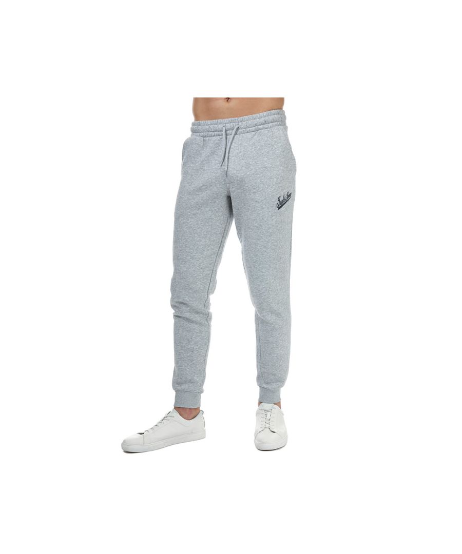 Mens Jack Jones Gordon Anything Jog Pant in light grey.- Drawstring waistband with drawstring.- Two side pockets.- Cut from soft loopback cotton-jersey.- Ribbed cuffs.- Logo print at side pocket.- 67% Cotton  30% Polyester  3% Viscose. Machine washable. - Ref: 12172030C