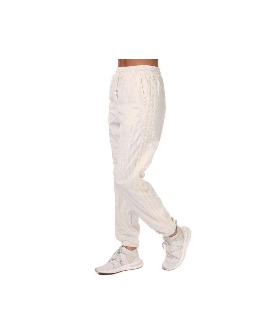 Womens adidas Originals Cuffed Pants in off white.- Drawcord on elastic waist.- Front pockets.- Elastic cuffs.- Soft velvety feel.- 3-Stripes.- Corduroy.- Regular fit.- Main material: 100% Polyester. Pockets: 100% Cotton. Machine washable. - Ref: GU0806