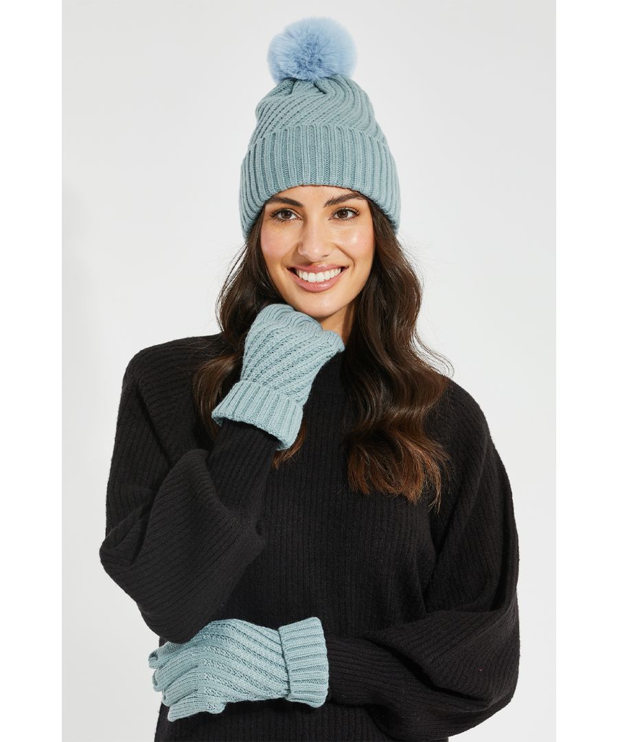 Keep warm when the temperature drops with this knitted hat with faux fur pom pom and gloves set from Threadbare. Perfect for accessorising outfits and staying cosy this winter. Other prints available.