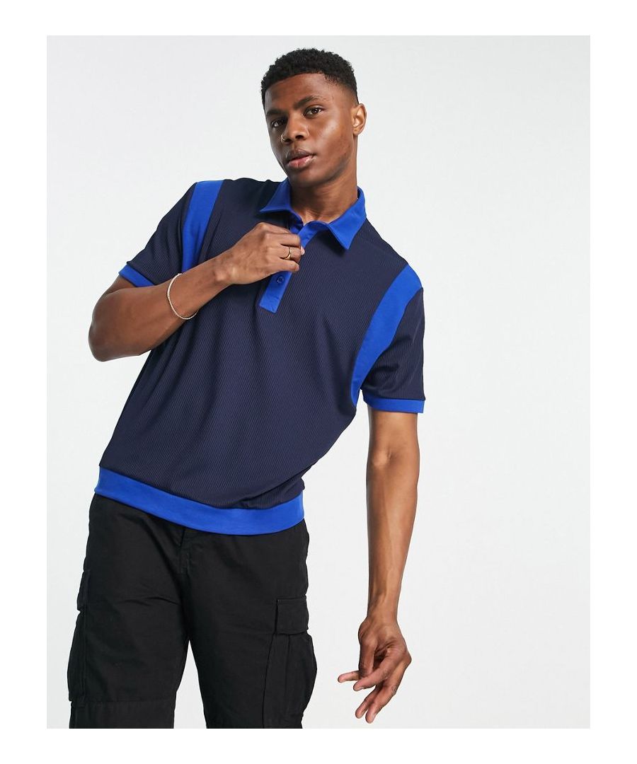Polo shirt by ASOS DESIGN Colour-block design Polo collar Partial button placket Relaxed fit  Sold By: Asos