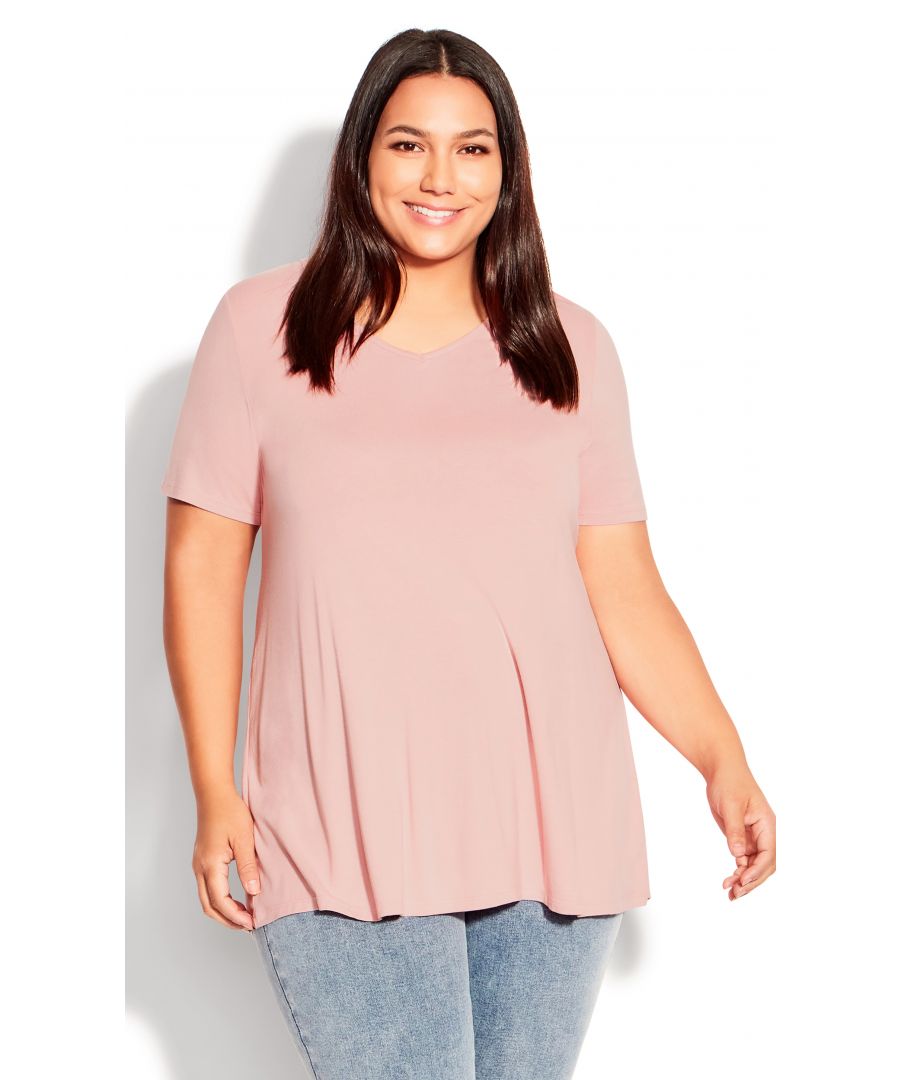 Looking for something soft and sweet? The Love Me Top is your perfect pick! This pretty pink top is made from a soft stretch fabric, ensuring you stay comfortable all day long. It features a V-neckline and short sleeves, making it perfect for warmer days. Key Features Include: - V-neckline - Short sleeves - Pull-over fit - Soft stretch fabrication - Relaxed silhouette - Hip length hemline