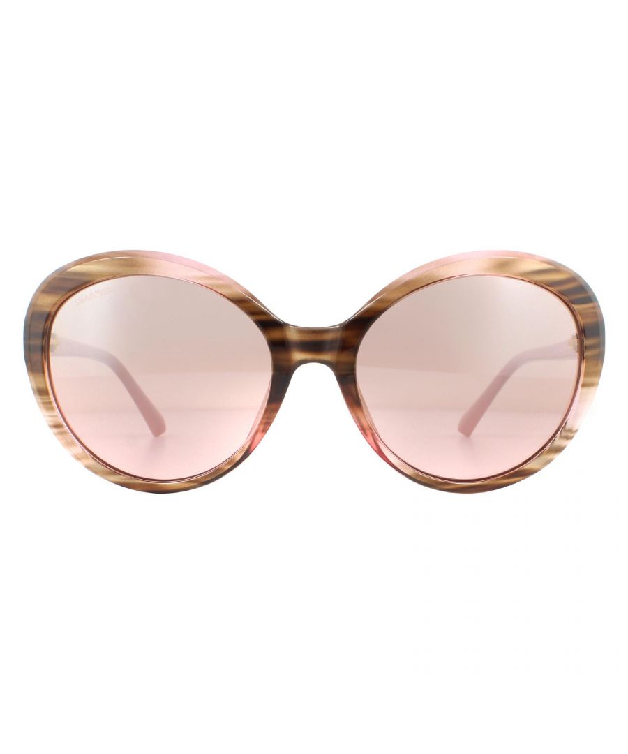 Swarovski Sunglasses SK0204 72G Shiny Pink Pink Brown Mirror have oversized round lenses and an acetate frame. Slender temples are decorated with the Swarovski logo, and sparkling Swarovski crystals at the hinges.