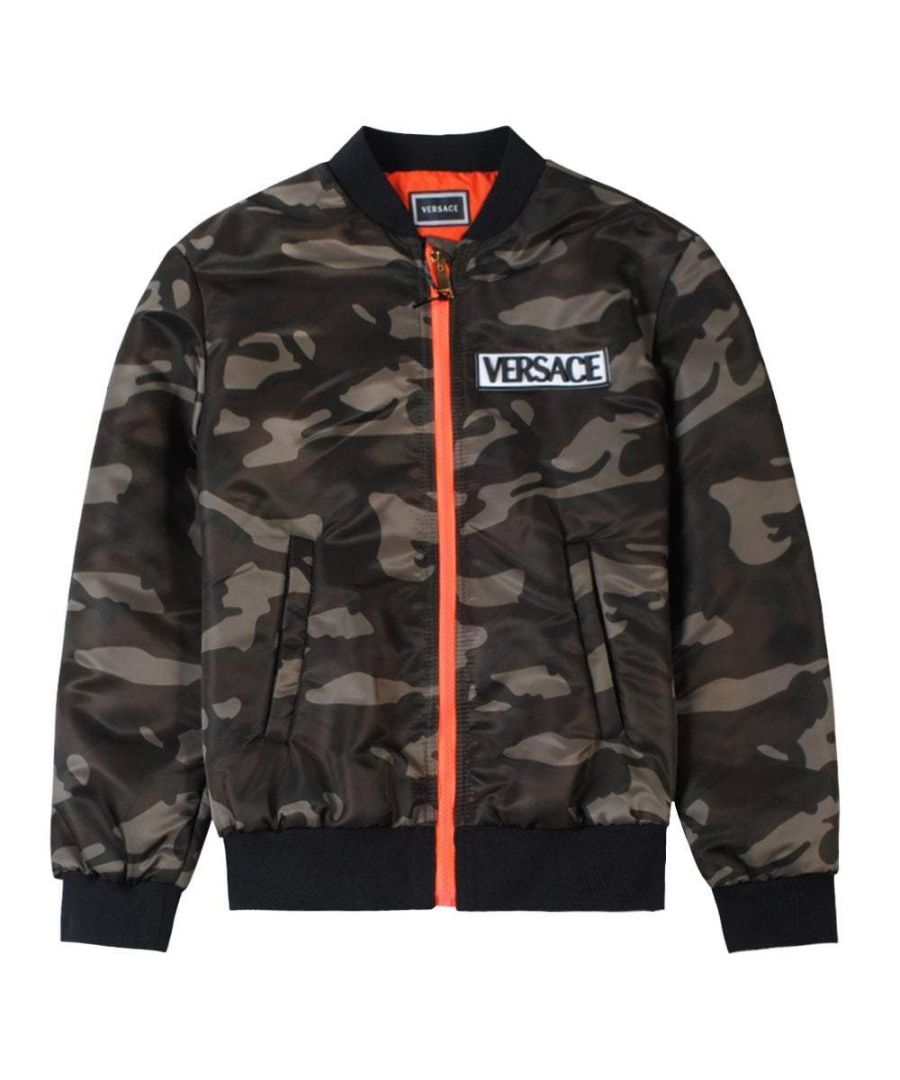 This Young Versace camo jacket for kids, features embroidered rubber logo on the front of the jacket. it features ribbed collar, cuffs and hem with orange zip fastening and orange inserts.