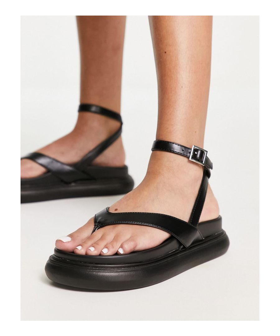Sandals by ASOS DESIGN It's open-toe season Adjustable ankle strap Pin-buckle fastening V-shaped straps Toe post Chunky sole  Sold By: Asos