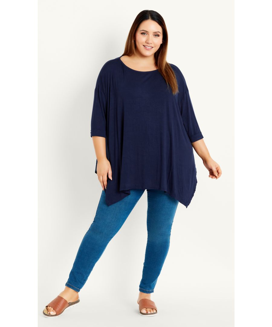 Elevate your wardrobe essentials with the flattering fit of the Hanky Hem Top. Featuring elbow length sleeves and a relaxed swing silhouette, this long top is perfectly paired with denim for casual weekends. Key Features Include: - Scoop neckline - Elbow length sleeves with rolled cuff - Relaxed fit - Handkerchief hemline Style with skinny leg jeans for a flattering finish.