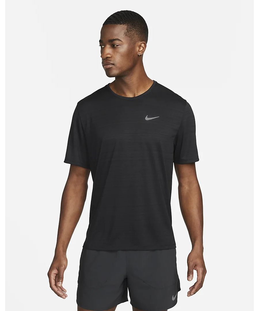 The Nike Dri-FIT Miler Men's Running Top helps keep you comfortable in sweat-wicking, breathable fabric. The back mesh panel provides targeted ventilation.Nike Breathe fabric helps you stay dry and cool.\nDri-FIT technology helps you stay dry, comfortable and focused.Mesh panel enhances breathability.Standard fit follows the shape of your body.Dropped back hem helps keep you covered as you move.