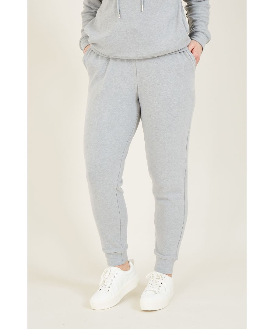 Achieve ultimate comfort when you opt for our Yumi Velour Loungewear Joggers. In an easy shape that's fitting for weekends, it's styled with a tapered leg to ensure a flattering cut. At the waist, this pair of loungewear trousers feature a drawstring tie crafted from luxurious velour for a contemporary feel. The supple jersey creates a comfortable fit, complemented by cinched cuffs for the perfect finish. Team with an knitted jumper, slippers or pop on a pair of trainers with a shirt for everyday style. Or, choose the matching hoodie from our range.  70% Viscose 25% Polyester 5% Elastane Machine Wash At 30